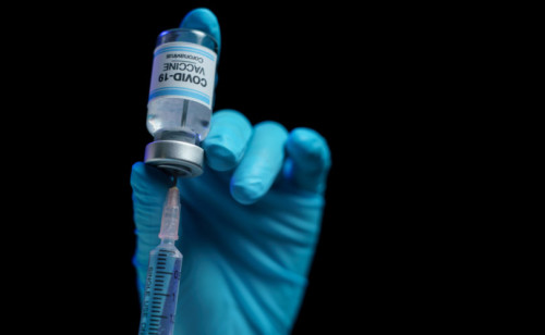 Hand,In,Blue,Glove,Holding,Vaccine,And,Syringe,Injection,For